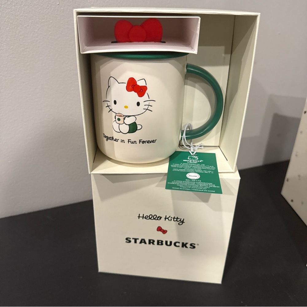 Starbucks Hello Kitty Mug with Green Handle and Red Bow Lid